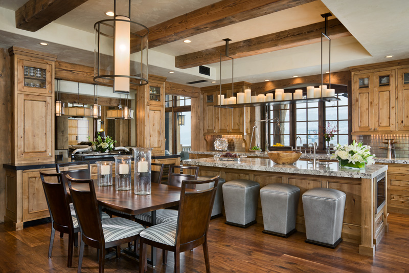 A large dining room with wooden floors and bar.