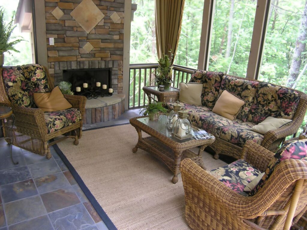 A living room with furniture and a fireplace.